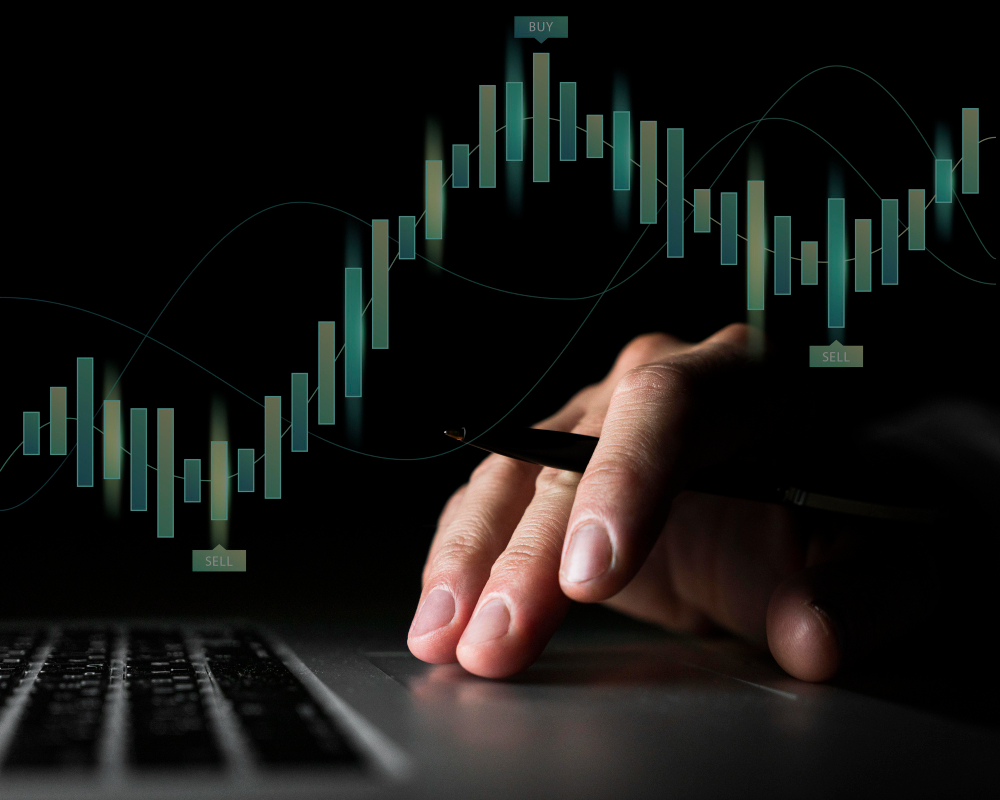 Trader analyzing candlestick chart patterns on a computer using a forex breakout indicator